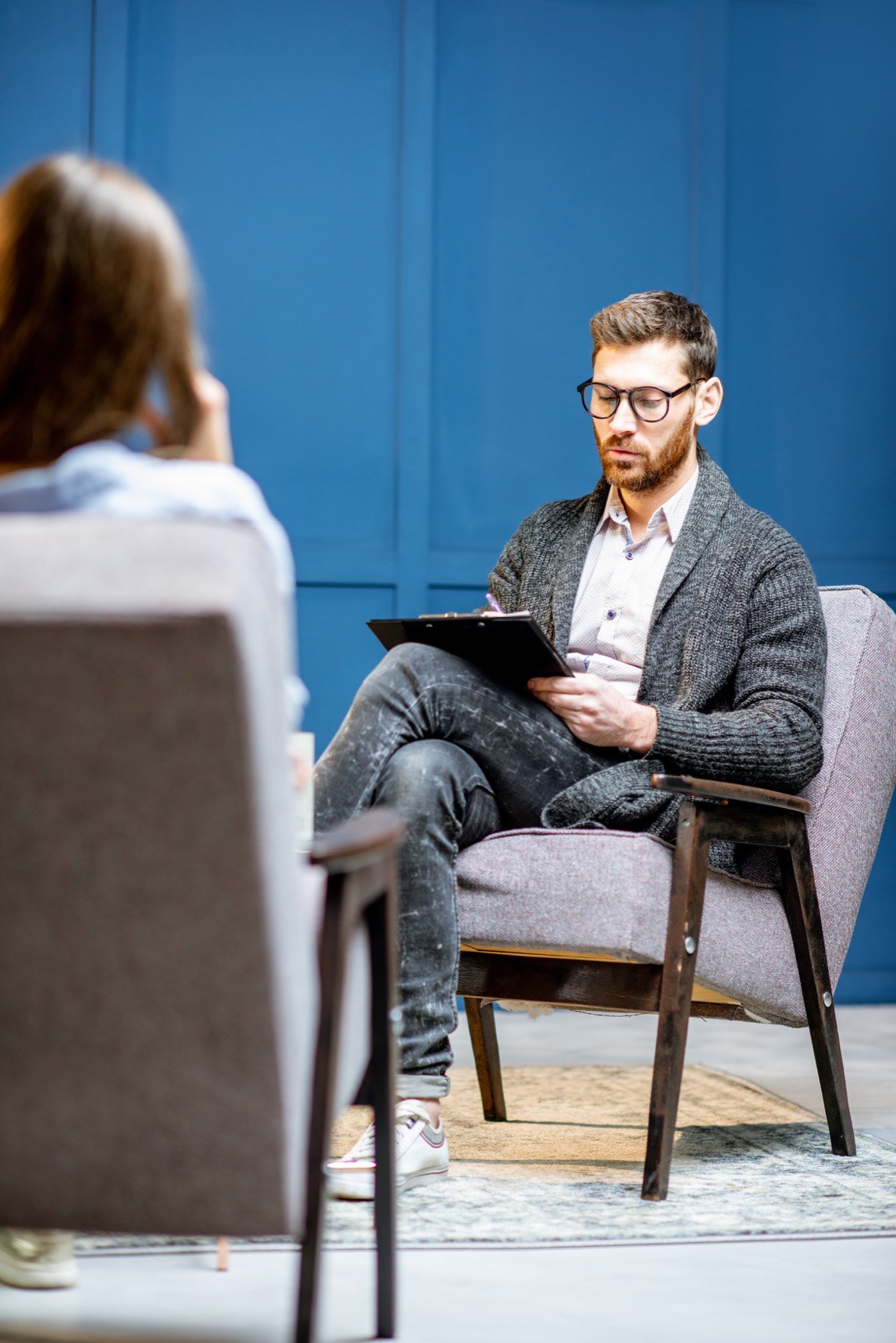 A counselor listening closely to a client
