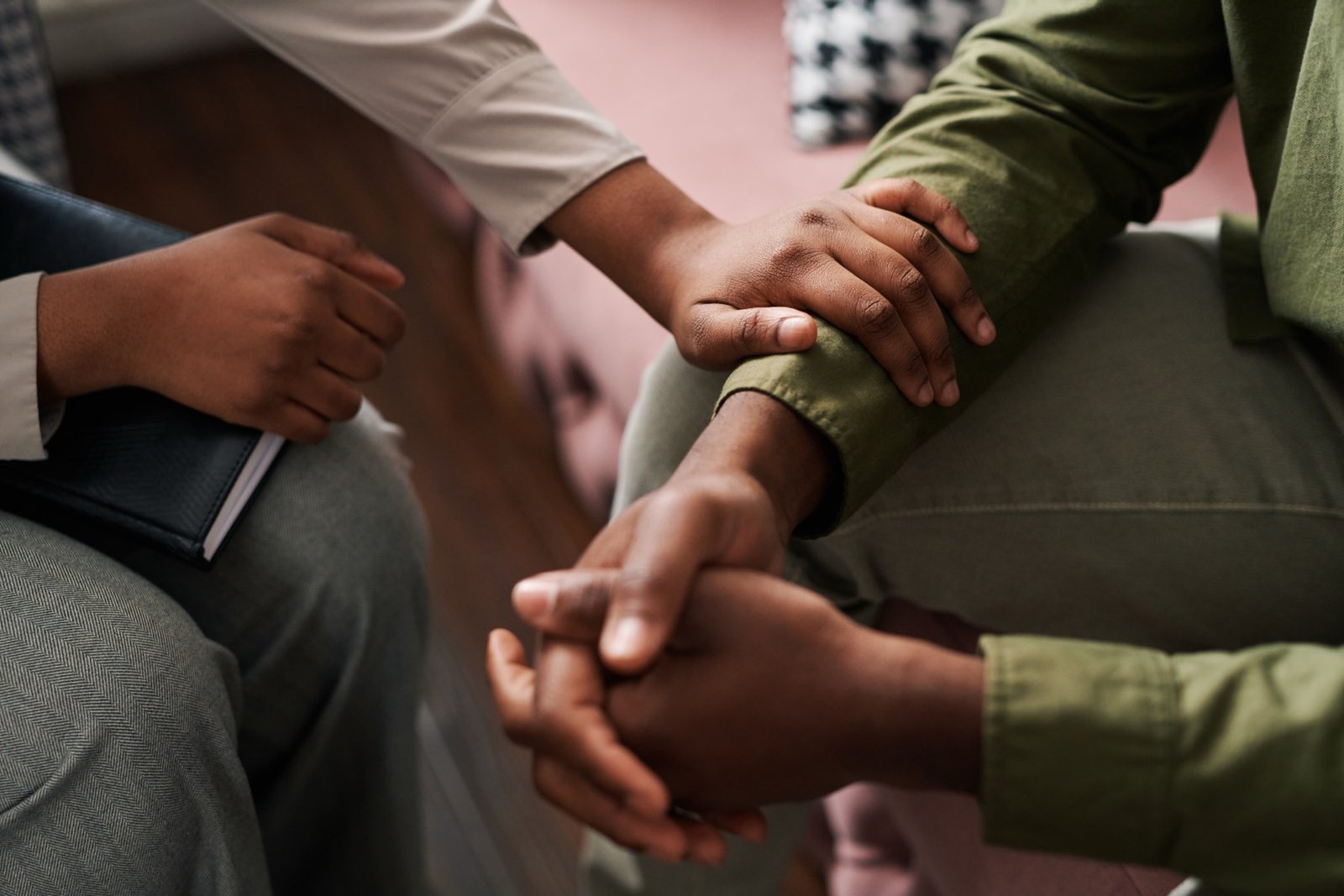 Supportive hands offering comfort