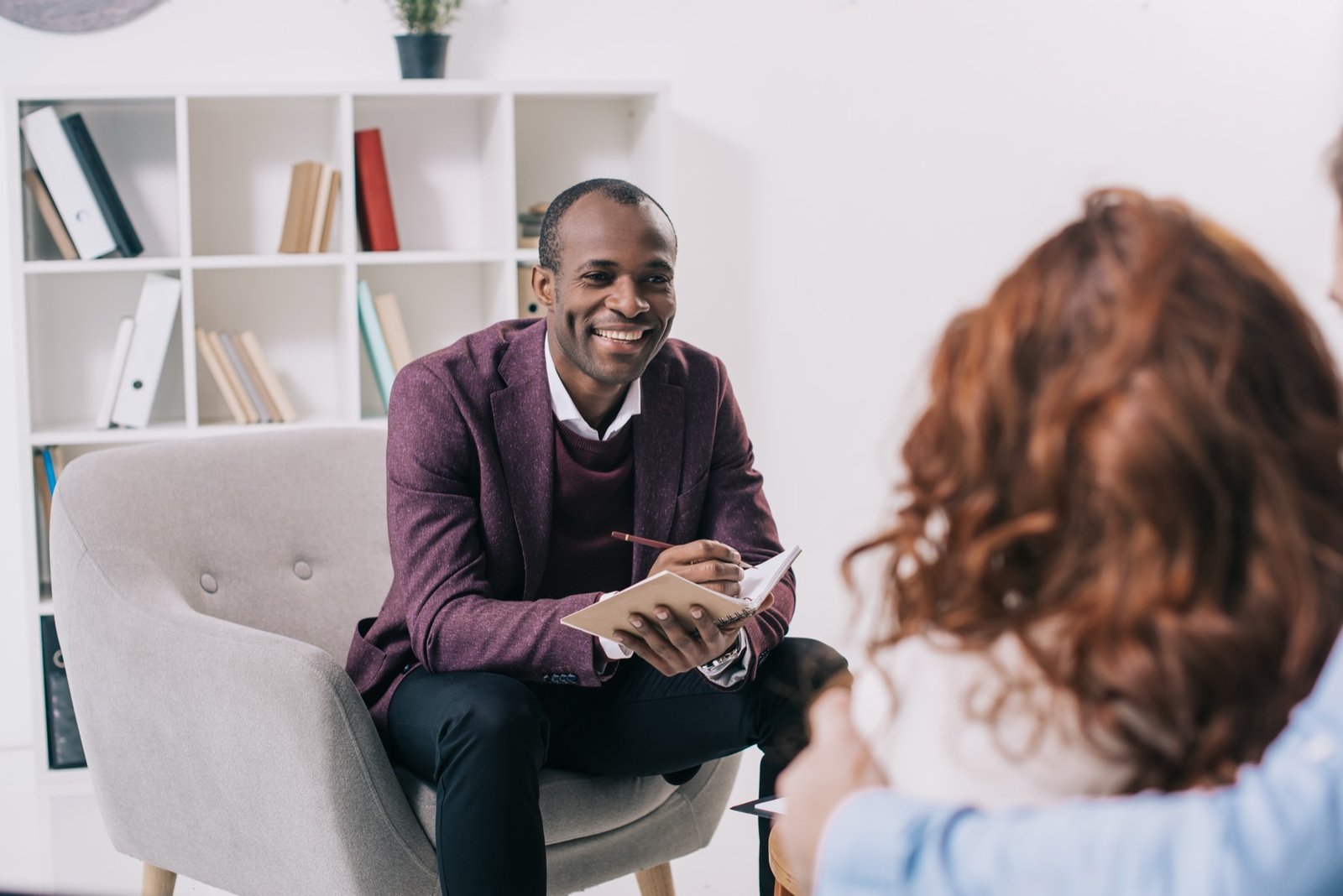 A counselor talking warmly with a couple